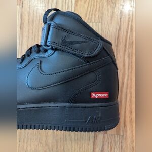 Nike Black High-Top Sneakers with Supreme Logo